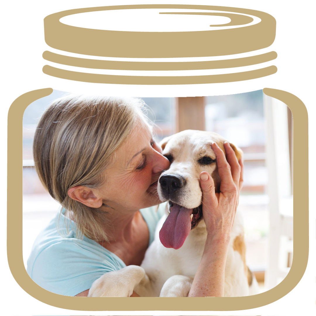 a gold jar, inside a woman hugging her dog for a legacy memorial photo. The dog is happy with his tongue hanging out